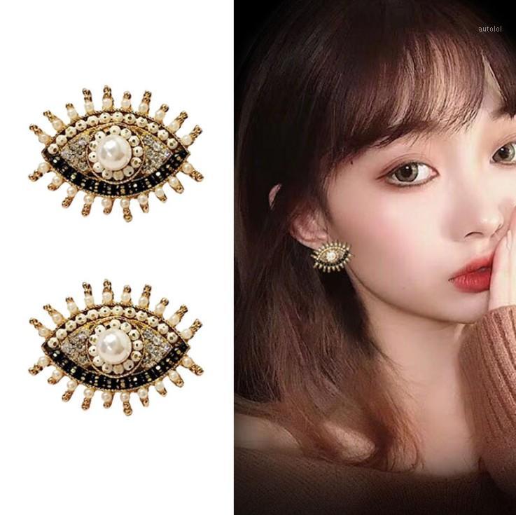

925 Silver Needle Japanese and Korean Temperament Earrings Female Wild Angel Eye Earrings Simple Sexy1