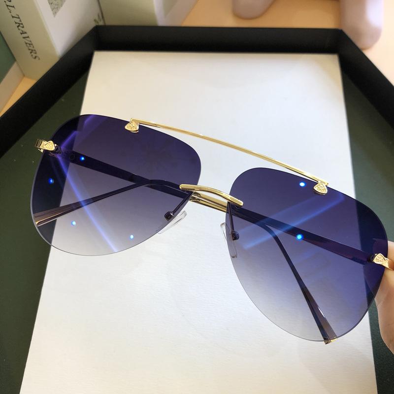 

Wholesale Vintage Rimless Alloy Pilot Sunglasses For Men Women Brand Gradient Sun Glasses Female Blue Oval Shades