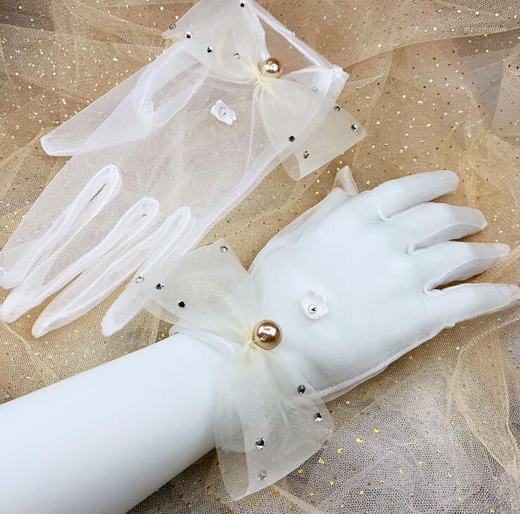 

Women's elegant white color beaded bow mesh glove female spring summer sunscreen lace driving glove R30531