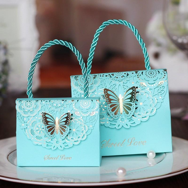 

50 unids/lote creativo de flores de mariposa bolsas regalo Cajas caramelos para bodas favores portatil