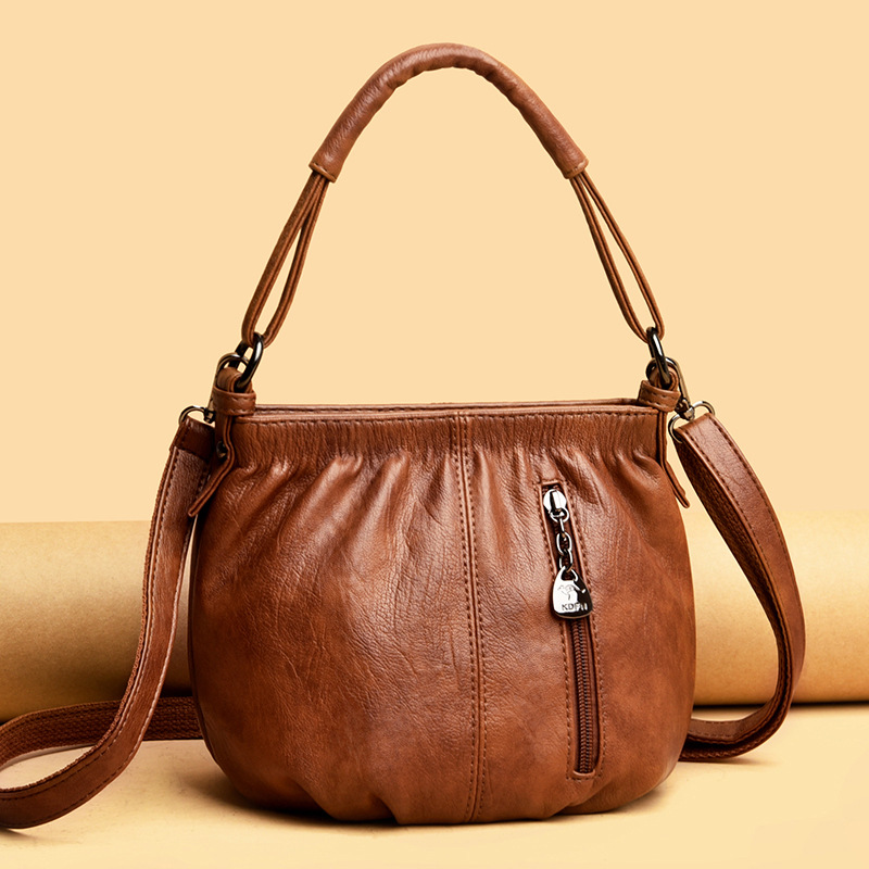 

Wholesale factory ladies leather shoulder bags simple atmosphere solid color Joker handbags sewing retro bucket bag zipper decorative fashion mother handbag