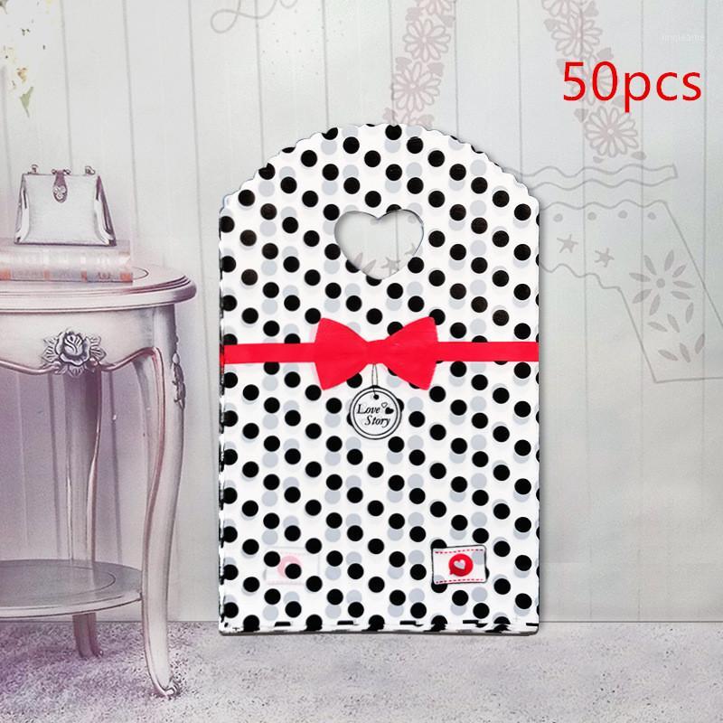 

50pcs/lot 13*21cm Gift Bags Handles Plastic Bag For Clothes Storage Bag Party Supplies Shopping Packaging Wedding Decoration1