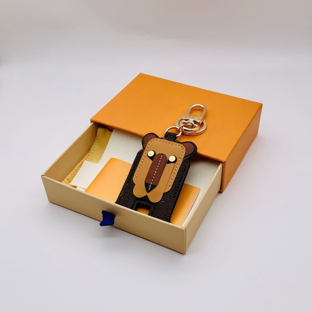 

Fashion Lion Keychain 2021 Men Women Designer Leather Keychains with Box and Dust Bag Cute Wallet Bags Car Handmade Key Chain Buckle