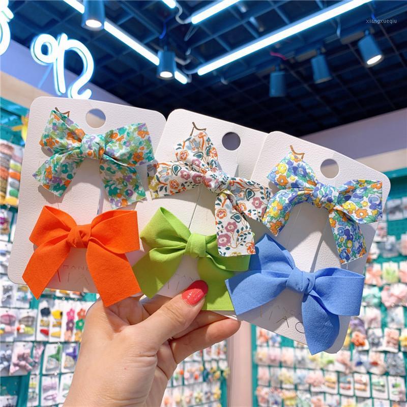 

2 Pcs Ethnic Style Sweet Girl Simple Fresh Floral Fabric Bow Duckbill Clip Fashion Children Student Barrettes Hair Accessories1