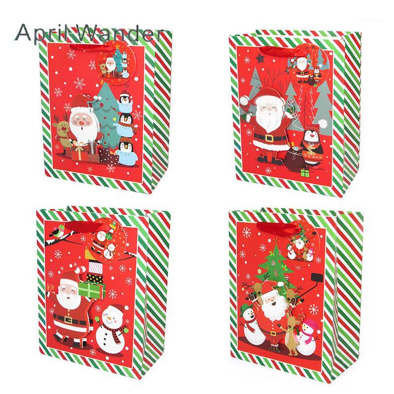 

4pcs/lot Lovely Christmas party bags Xmas Handbags Paper Santa Claus Gift Bags with handles for Merry Christmas Party Supplies1