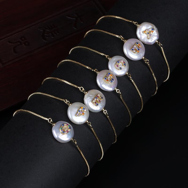 

Gold Micro Pave Rainbow CZ Cubic Zirconia 26 Alphabet Letter Name Charm Freshwater Coin Pearl Gold Chain Bracelet For Women Girl