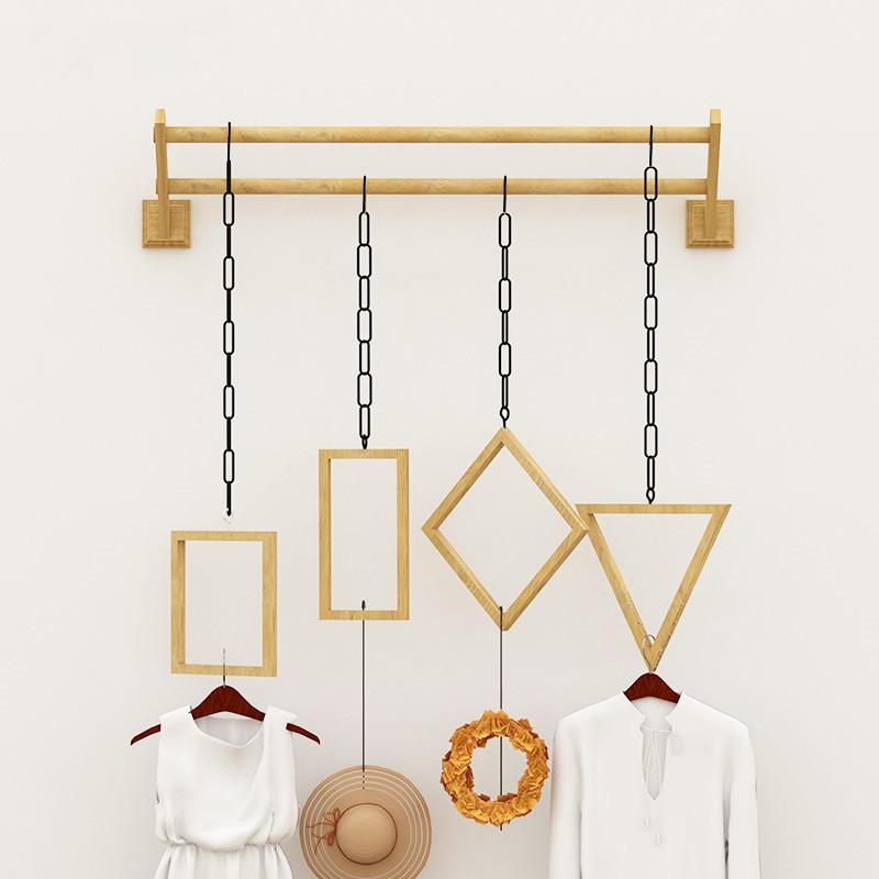 

Multifunctional hanger hanging on the wall of display rack in clothing store
