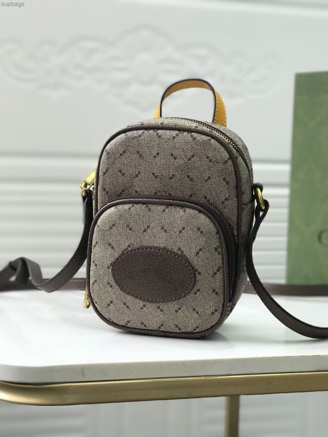 

The Ouverture Collection Woman Neo Vintage Mini Bag In Beige/Ebnoy Decorated By An Oval Leather Tag That Brings Together With A Feline