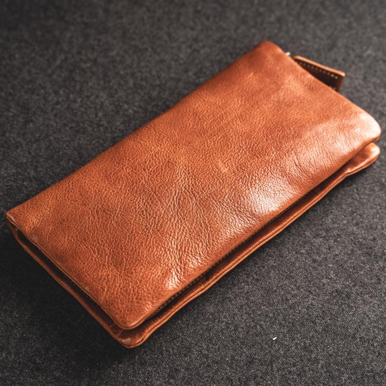 

The new men's genuine leather wallet in long hand head layer cowhide handbags retro screens zipper more boys, Black
