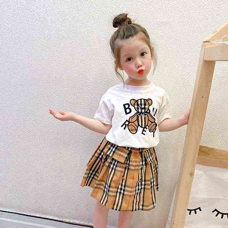 

Children's clothing summer girls' short sleeve set trendy doll print T-shirt + short skirt two-piece set, White