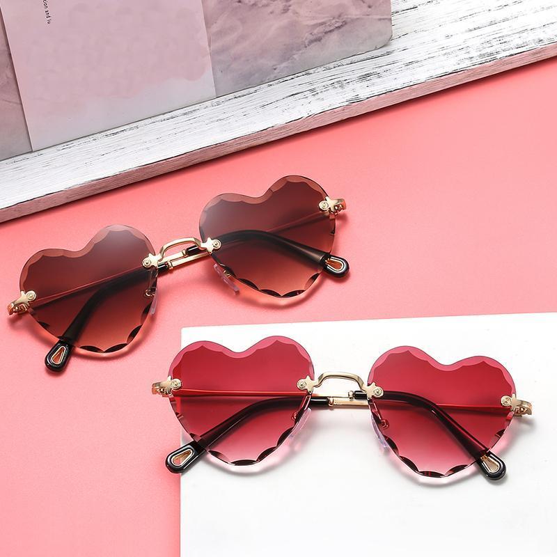 

2020 New Fashion Love Heart Shape Sunglasses Women Rimless Frame Tint Clear Lens Colorful Sun Glasses Red Pink Yellow Shades1