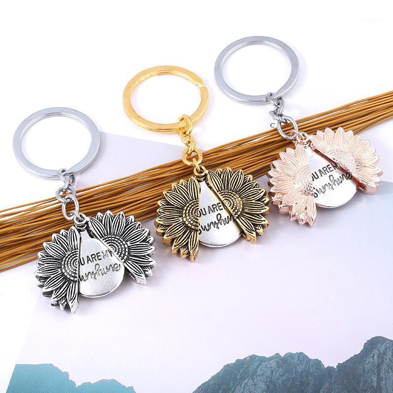 

ZXMJ lettering you are my sunshine keychain sunflower Can open pendant christmas gift car keyring Jewelry gift Accessories1