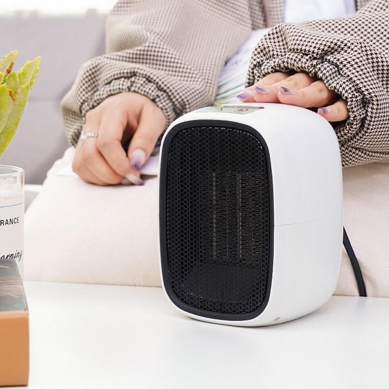 

New small mini desktop electric heater 220V 500W portable bedroom household office heating fan hot air wind out prevent falling
