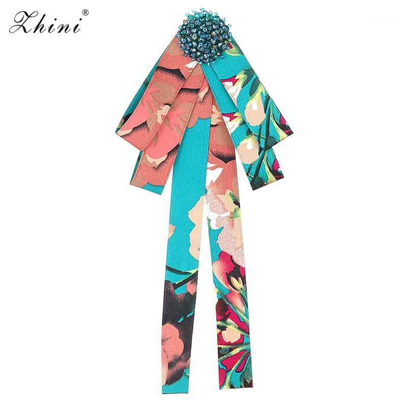 

ZHINI New Bow Crystal Women Brooches Pins Canvas Fabric Bowknot Bead Necktie Corsage Brooch for Women Clothing Dress Accessories1