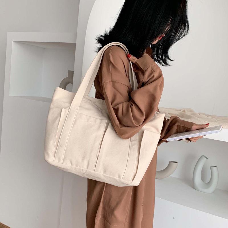 

Large-capacity solid color Japanese canvas bag female shoulder bag student simple portable canvas wild female, Black
