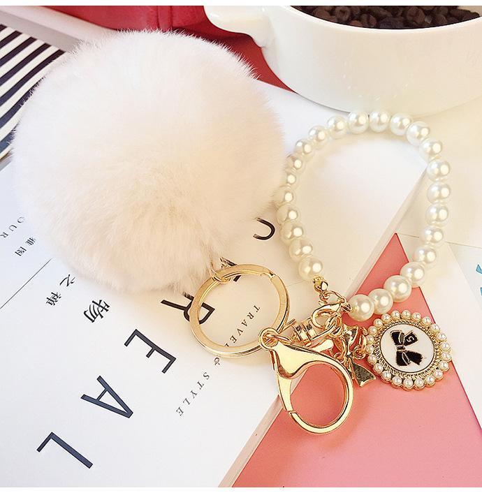 

Pearl Bow Tag Pompon Key Chain Fluffy Leopard Print Key Rings Women Bag Car Keychain Charm Pendant Pom Pom Holder Gift1