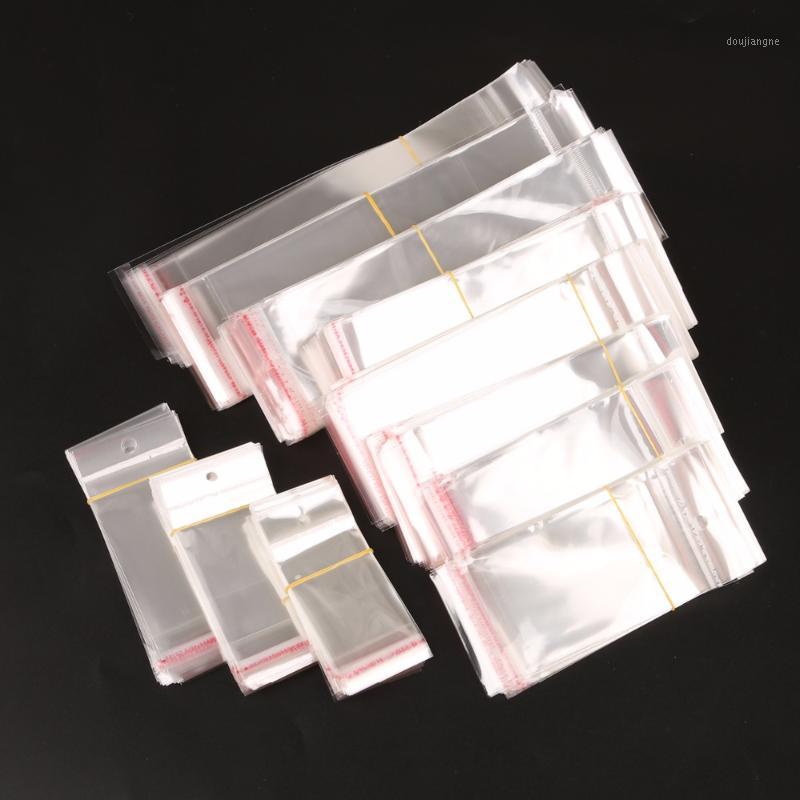 

100Pcs/ Lot Clear Self Adhesive Seal Plastic Bag Pouch Party OPP Packing Storage Bags Hang Hole1