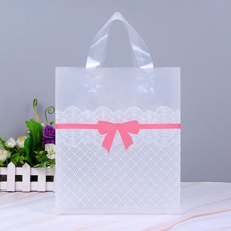 

50pcs/pack Clothing Plastic carry bag Lovely Gift Shopping Bags Party Favor Thicken Plastic Wedding loop Handle Bag