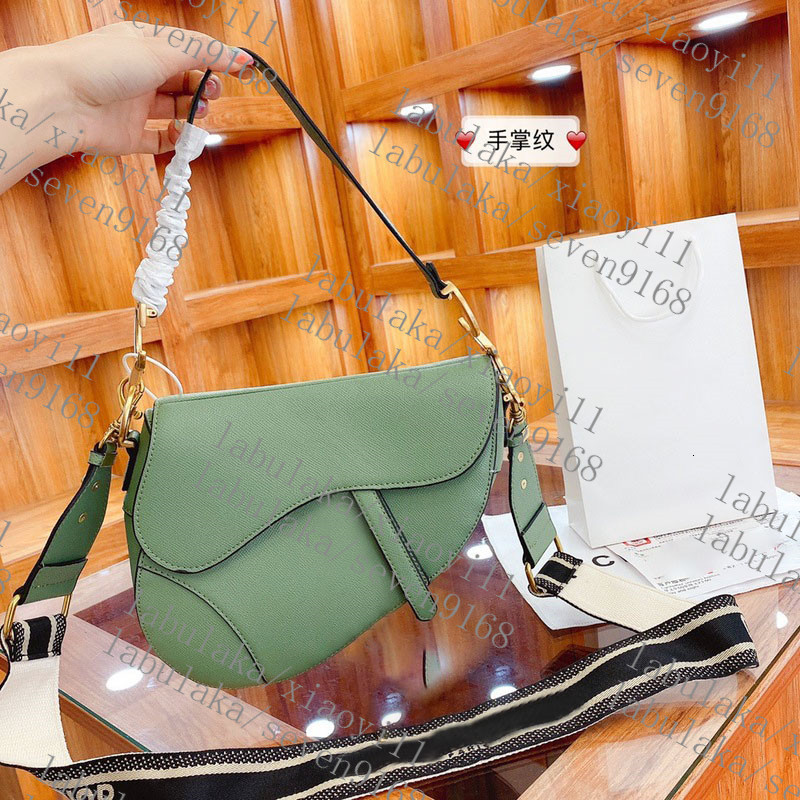 

2020Handbag Saddle bag Top quality Genuine Leather With shoulder strap Purse Metal pendant Shoulder bags women Crossbody bagCowhide handbags