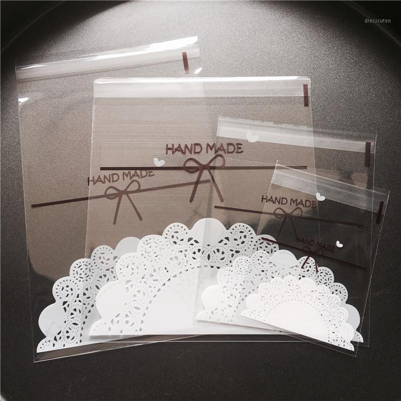 

100pcs/lot 4 sizes Transparent bow lace Plastic Self Adhesive Cookie Packaging Bag Wedding Candy Gift Decoration Bag1