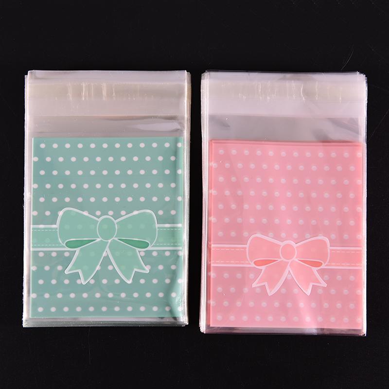 

100pcs Gift Sealing OPP Plastic Wedding Decor Bag/ Lovely Pink And Blue Bow Design Cake Cookie Gift Packages Candy Packing Bags