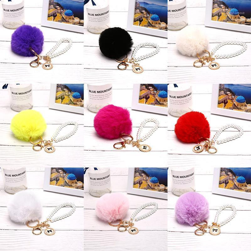 

Pompon Keychain Simple key chain Fur ball Pompom Artificial Fur Animal Keychains For Woman Car Bag KeyRing 9 colors1