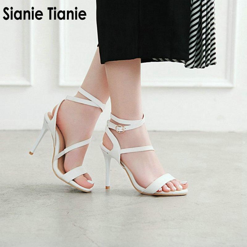 

Sianie Tianie 2021 summer new woman shoes white black super thin high heels ankle buckle cross strap women gladiator sandals1