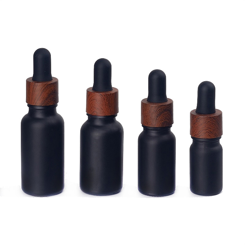 

Black frosted glass dropper bottles essential oil perfumes bottle with wood grain plastic cap 5ml to 100ml