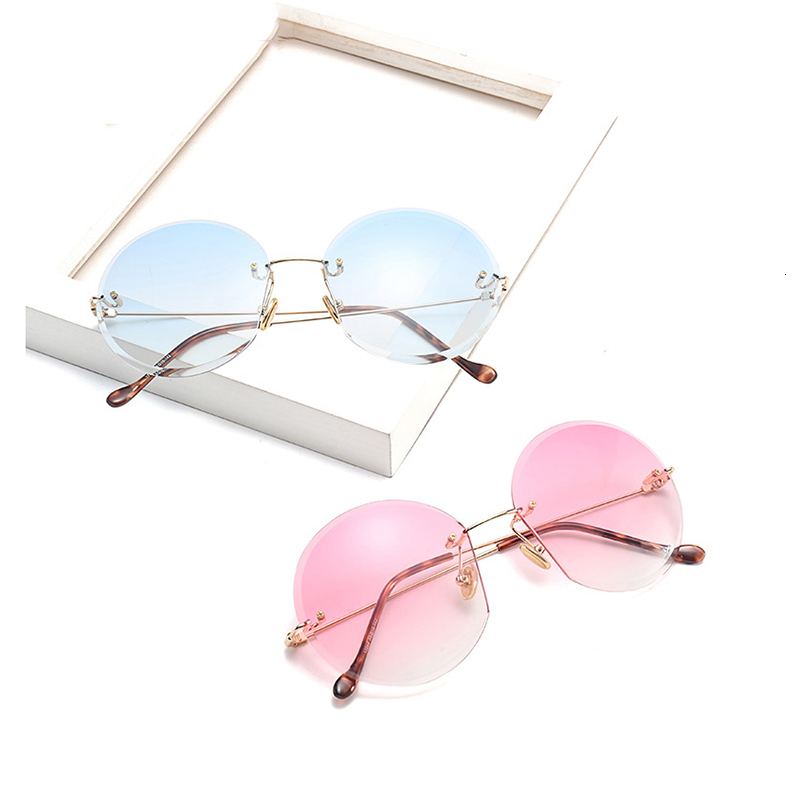 

2021 New Round Rimless Metal Sunglasses Women Transparent Designer Two-tone Painted Summer Glasses Uv400 Df17044 Nwst