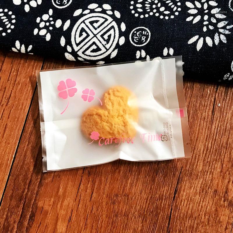 

100pcs/lot Pink Four Leaf Clover Carefree Time Baking Cookies Packaging Bag Transparent Plastic Sachets Baby Shower Gift Bags1