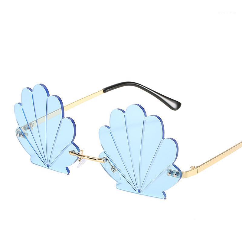 

Fashion Unique Flower Shape Rimless Women Sunglasses Brand Designer Retro Shell Grain Clear Ocean Lens Female Sun Glasses1