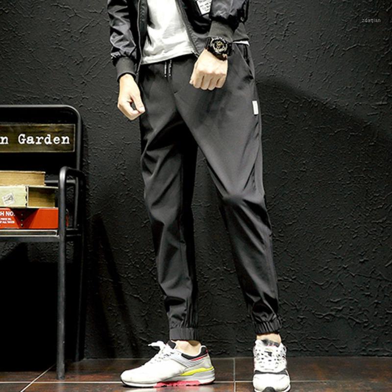 

Vogue Men Pencil Pants New Style Splicing Disassemblable Pants Two-Piece Overall Fashion Black Sweatpants Masculino1