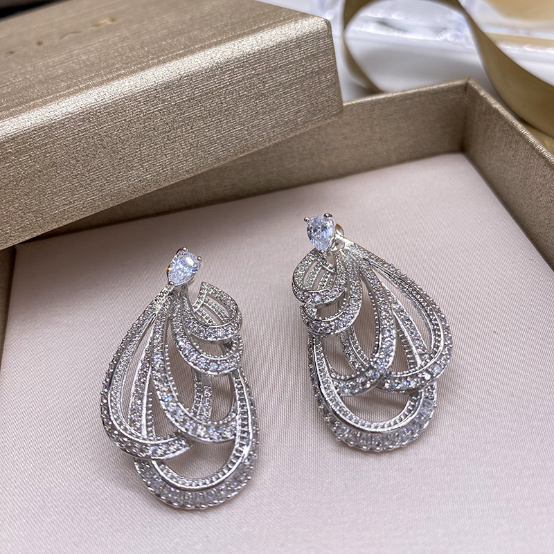 

Simple bow ribbon inlaid with full diamonds before earrings, European and American heavy industry drop-shaped holiday ladies