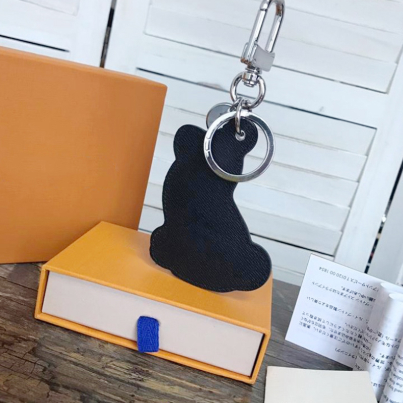 

Designer Keychains Chai Dog Keychain Luxury Design Calfskin Leather Key Chain Laser Embossed Logo Bag Pendants With Box