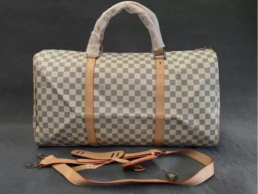 

Top Quality New Men Duffle Bag Women Travel Bags Hand Luggage Travel Bags Men Pu Leather Handbags Large CrossBody Bags Totes 55cm