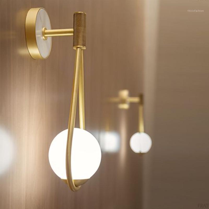 

Nordic personality creative designer living room metal wall lamp LED modern minimalist bedroom bedside glass wall lamp1