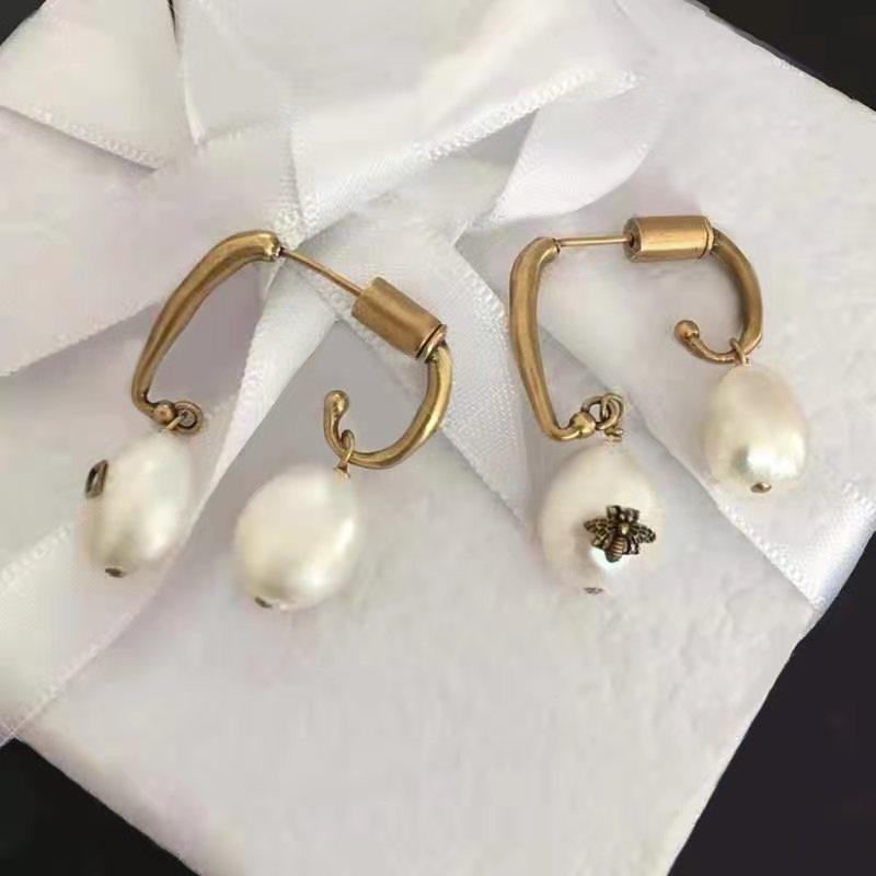 

Special-shaped pearl asymmetrical bee earrings women's retro letters old fashion simple new products Japan and South Korea s925