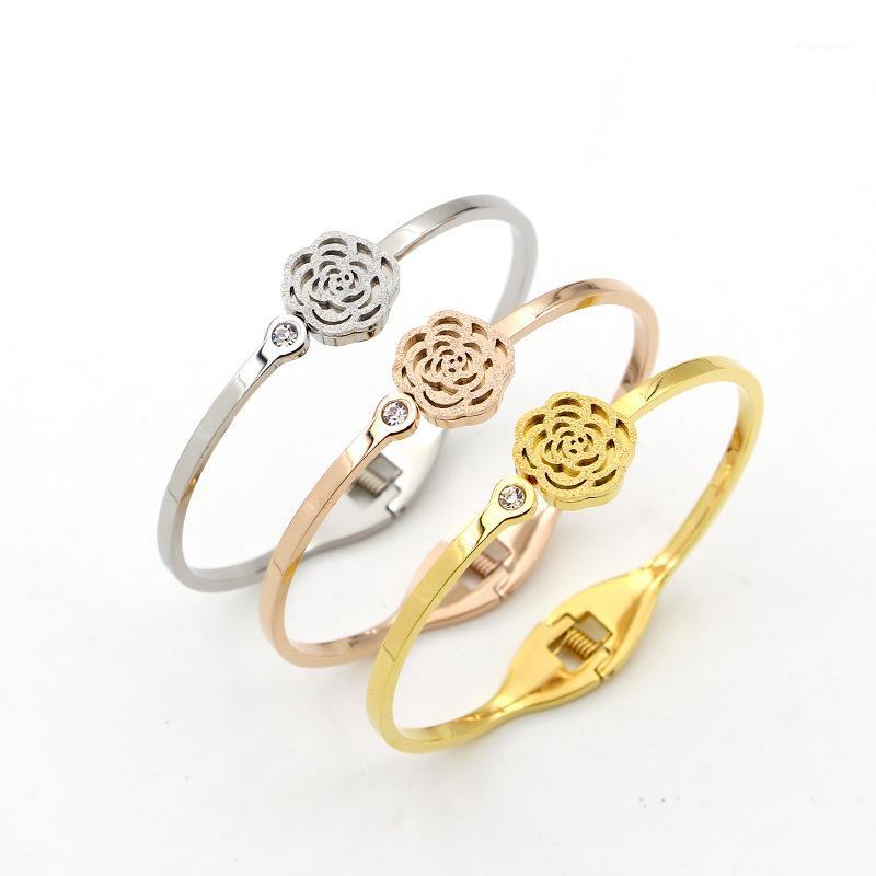 

Fashion Stainless Steel Crystal Hollow Camellia Flower Spring Bangle Bracelet Rose gold Women Party Christmas Gift1