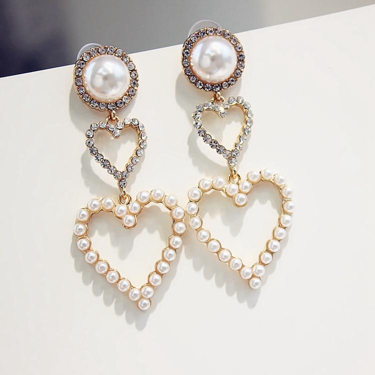 

Simple fashion personality wild pearl peach heart love earrings female temperament long sweet Korean earrings