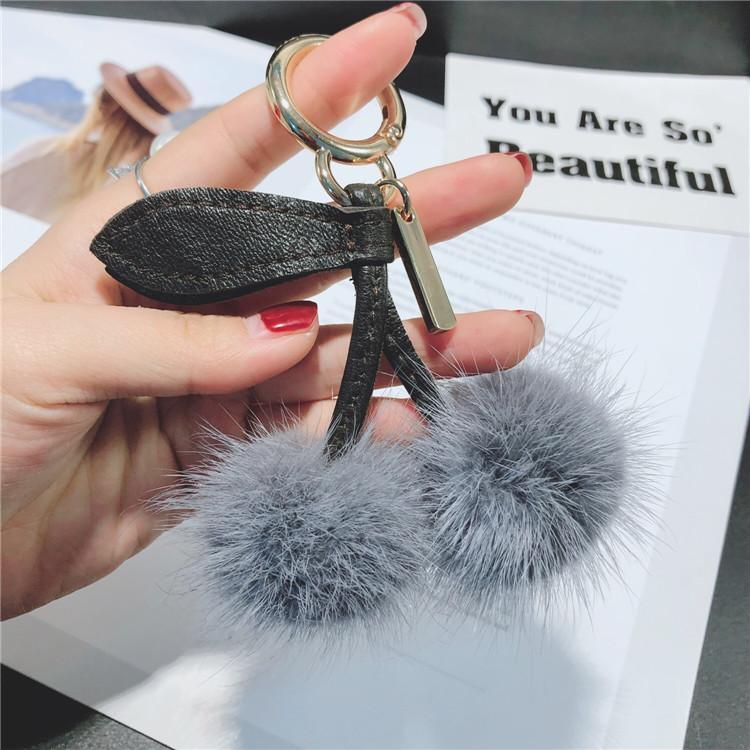 

Keychains Luxury Fluffy Pom Leather Keychain Keyring Cherry Bag Charm Llavero Pompon Backpack Key Chains Holder Chaveiro Gift