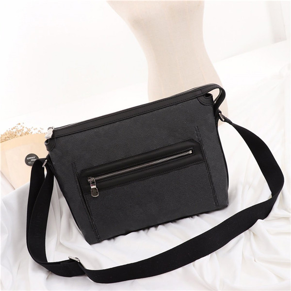 

Designer- man's bag. Business styling, fashion postman bag, front bag design, silver metal, wide shoulder straps, Black