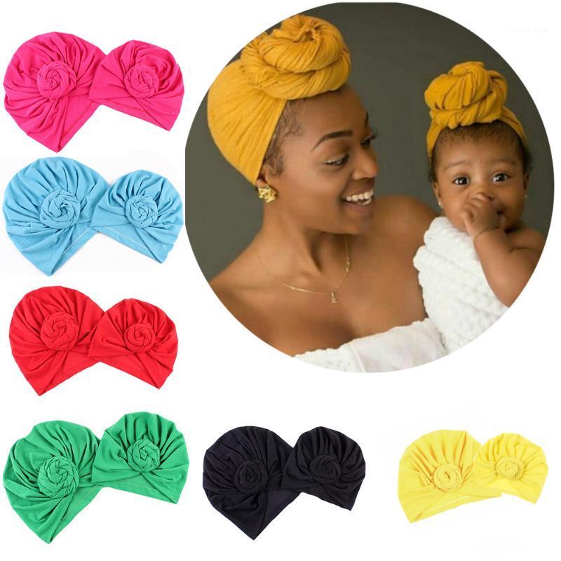 

Mom and Baby Solid Donut Hats Warm Turban Hood Solid Knotted Cap Cotton Cute Snails Hats Newborn Baby Knot Turban1