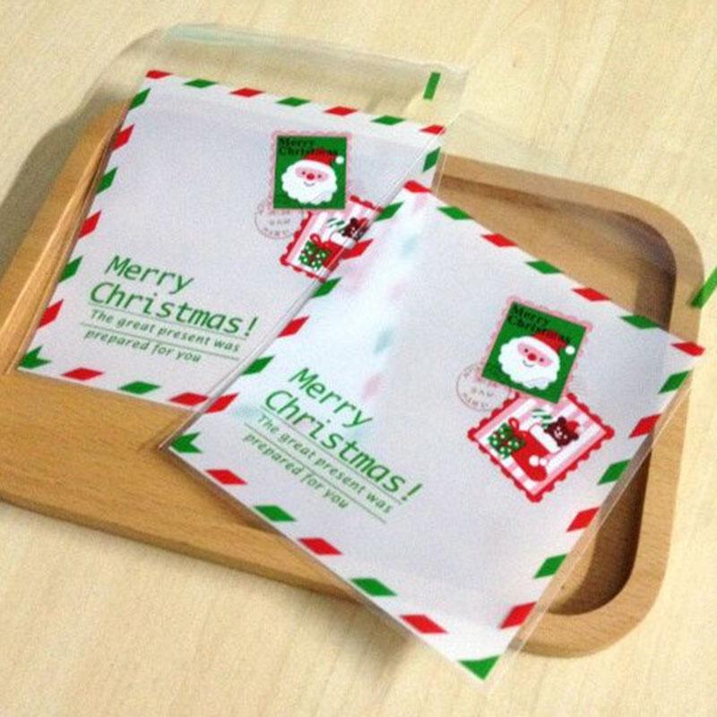 

50pcs Christmas White Frosted Color Border Envelope Handmade Cookie Bag Cartoon Santa stamp DIY Cellophane Self-Stick Goodie Bag