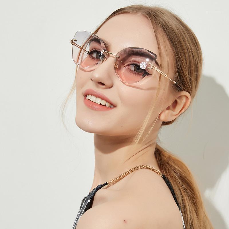 

Retro Personalized Metal Frame Sun Glasses Progressive Colorful Lens Cat Eye Borderless Colorful Crystal Texture Sunglasses1