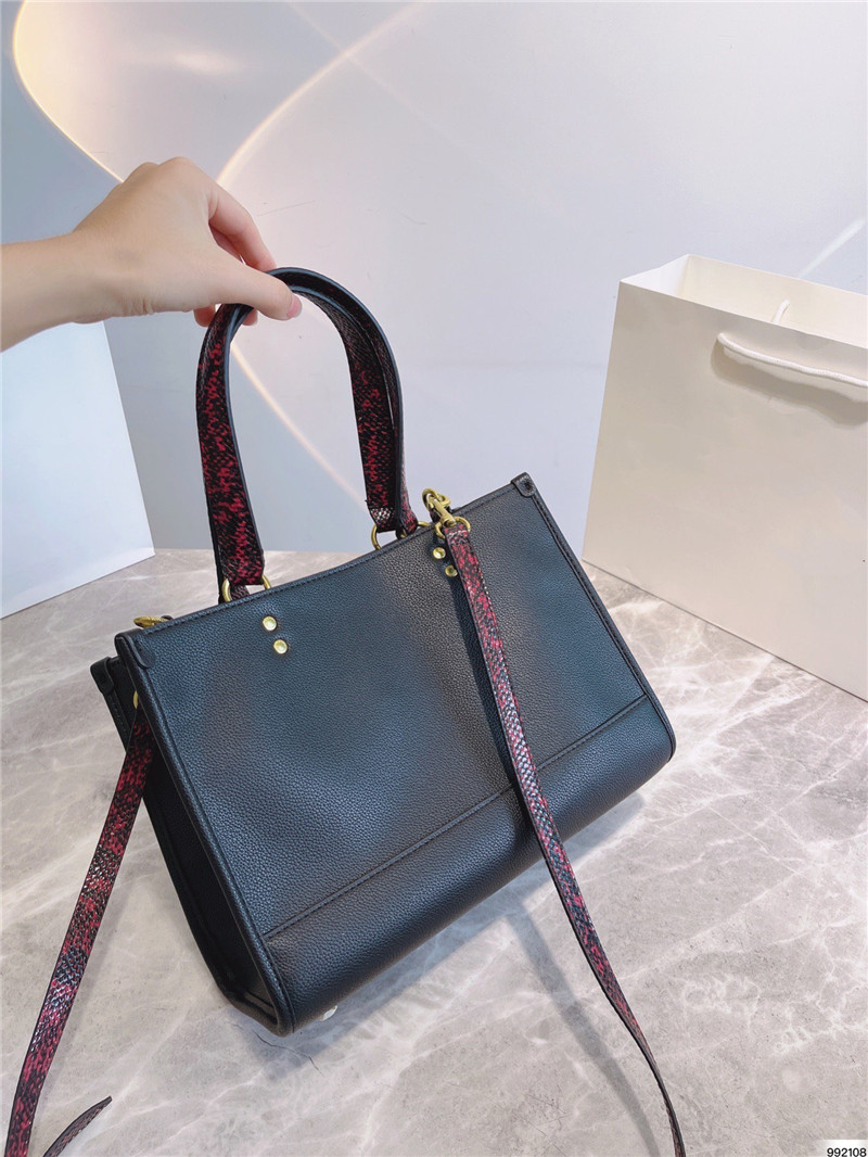 

Colorful cartoon patterns of small dinosaurs bag women high quality Black leather handbag Cute Totes Red Serpentine handle modern Bags