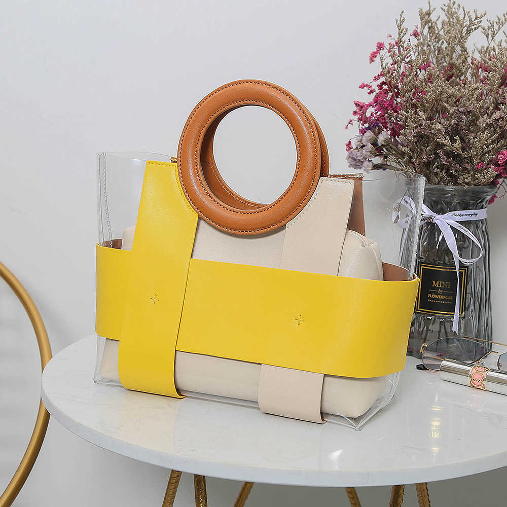 

Mlouye perspective handbag 2020 summer new color matching round wrist women's bag