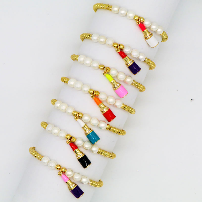 

Classic Womens Gold Copper Beads White Pearl Enameled Lipstick Charm Bracelet