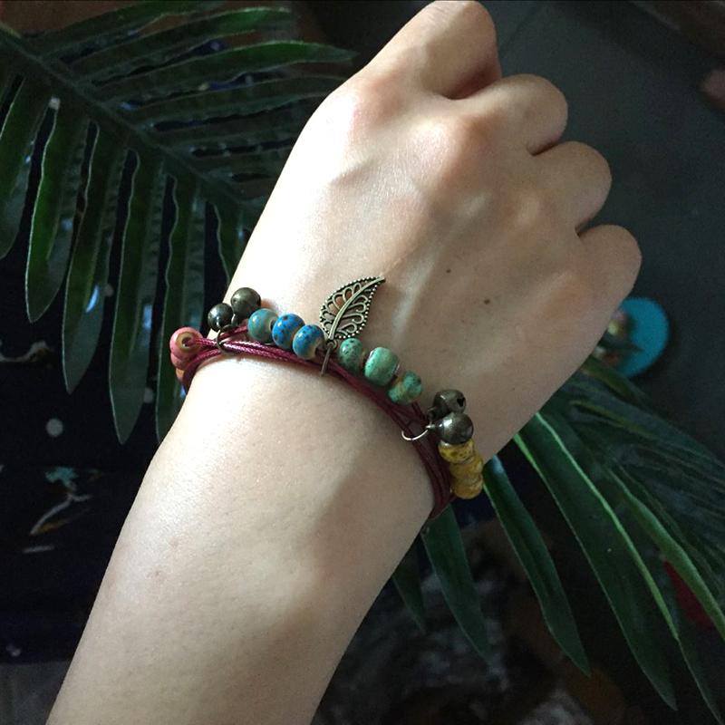 

Charm Bracelets Boho Style Handmade Ceramic Alloy Leaf Pattern Colorful Beaded Rope Chain Small Bell Bracelet Jewelry For Women