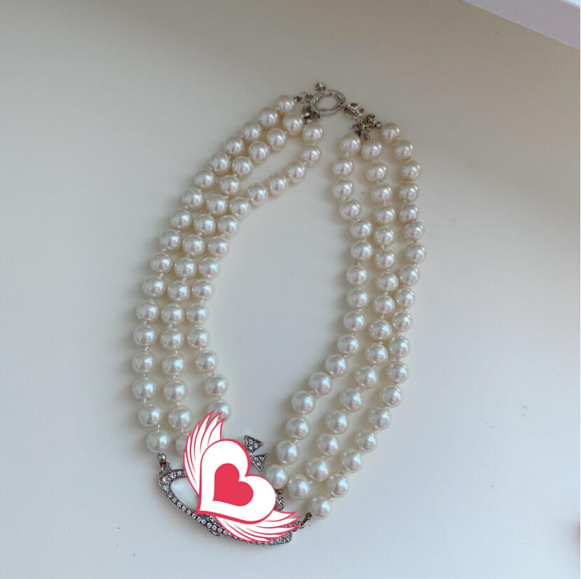

Hot new arrivals European and American catwalk stars with the same three-layer pearl full diamond retro planet necklace necklace clavicle ch
