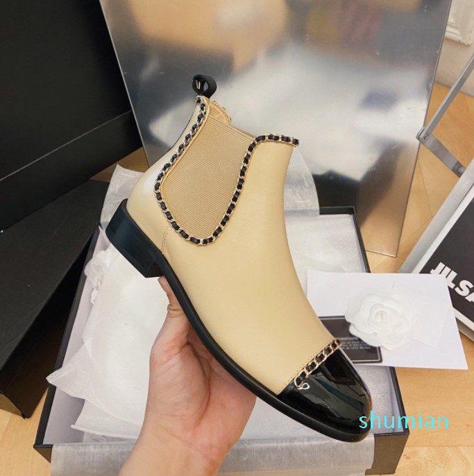 

Interlocking Beige calfskin leather ankle boots Chains-Link Accents Chelsea boot round Toe pull-on flats booties luxury designers shoes, Black